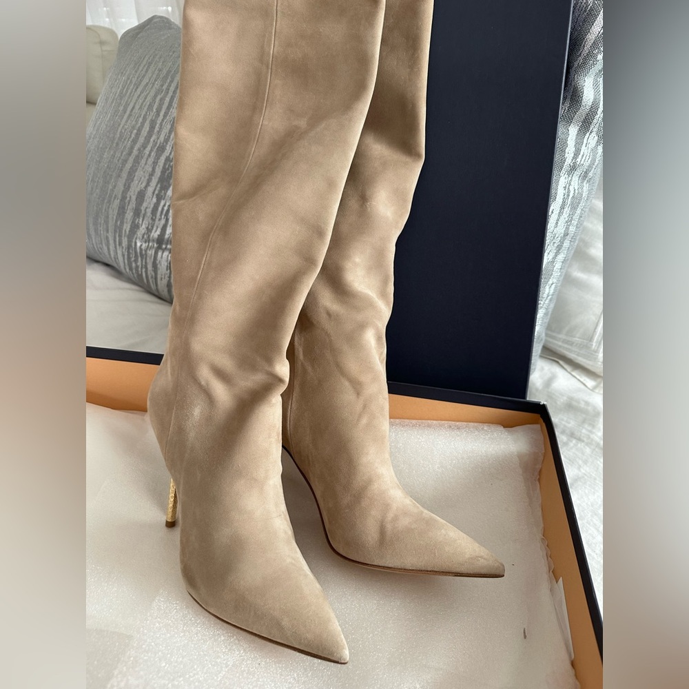 LOUIS VUITTON knee high heel boots. Heels have the LV logo stamped on them